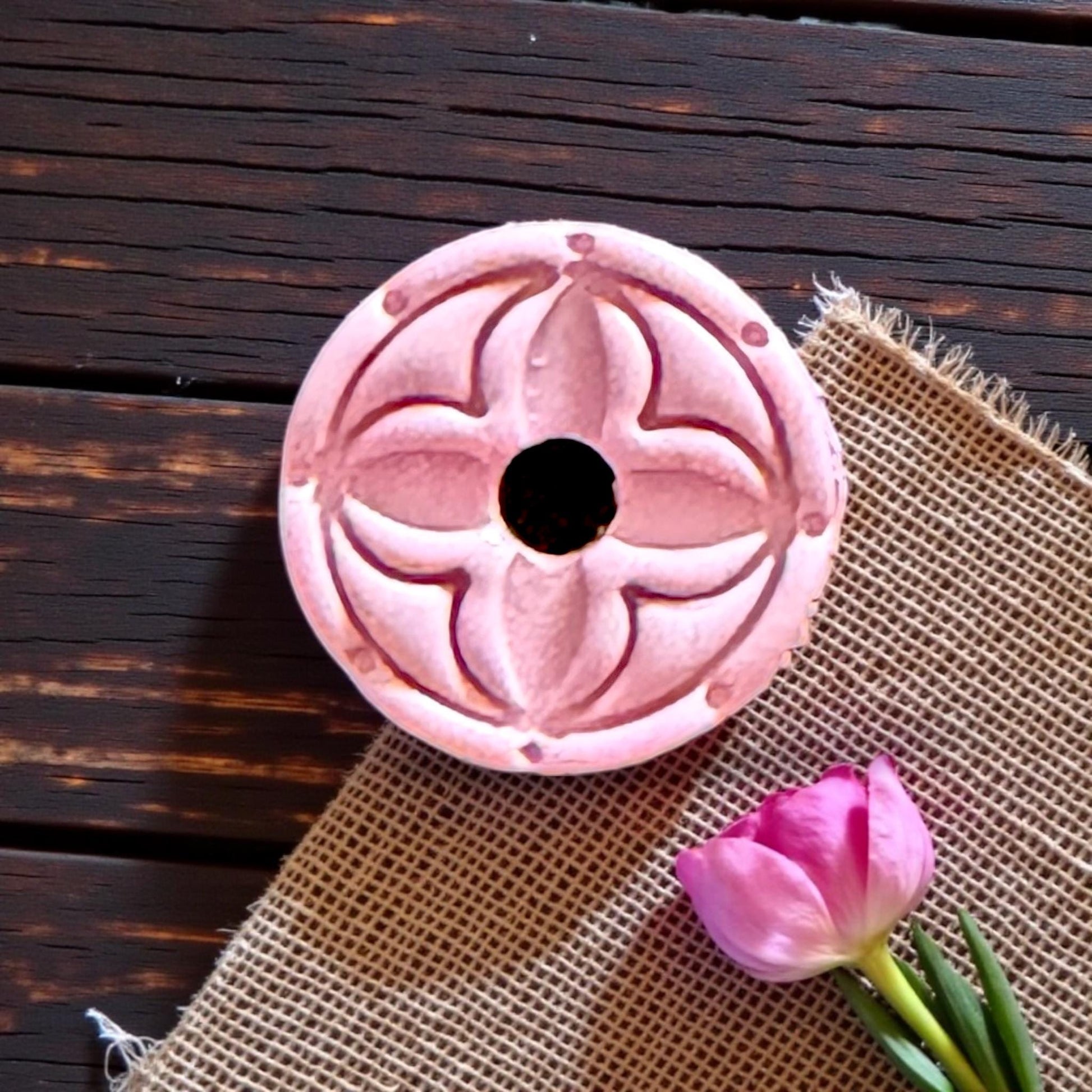 pink clay square with round floral design
