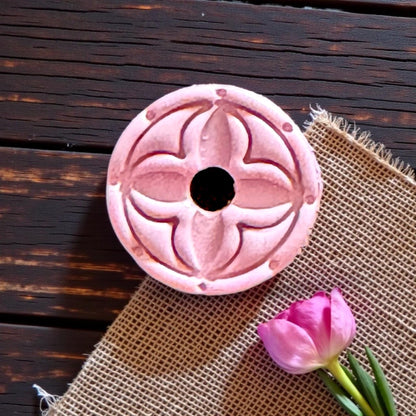 pink clay square with round floral design