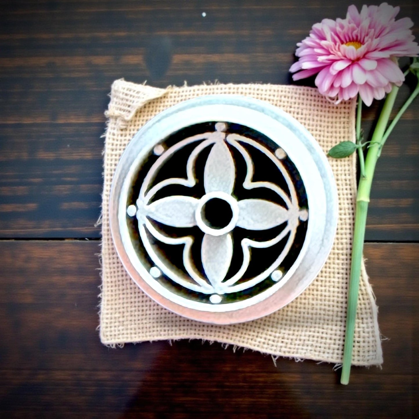 round floral clay charms on wood tray