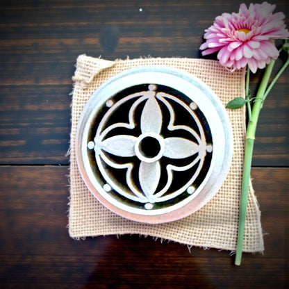 round floral clay charms on wood tray