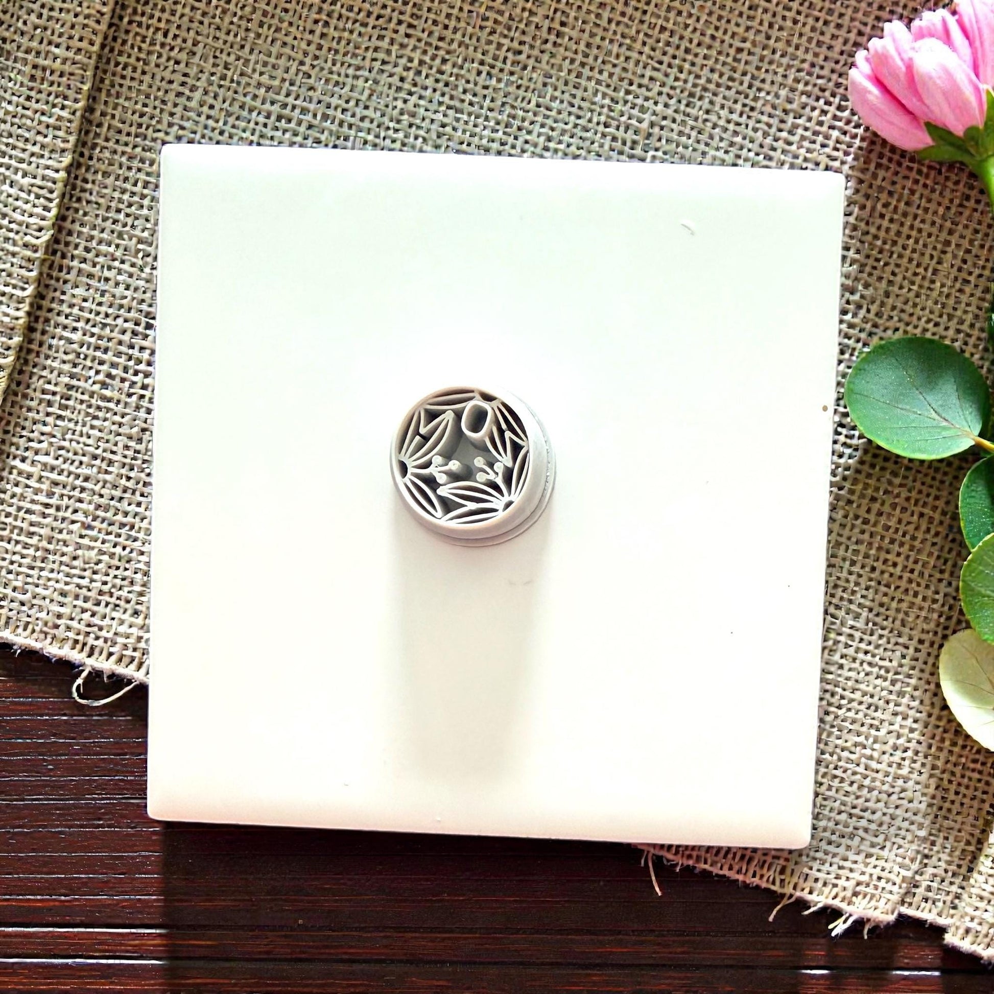 small botanical round cutter on tile
