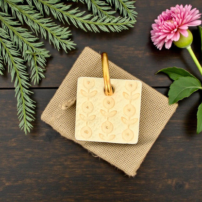 floral imprint in yellow clay close-up