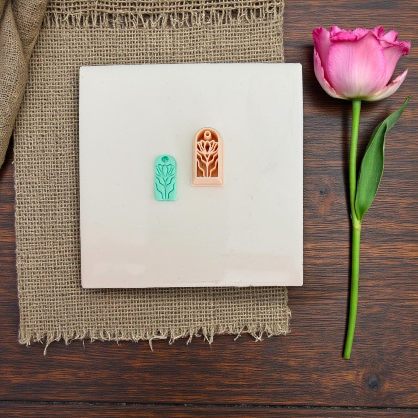 Small floral charm cutter on white tile