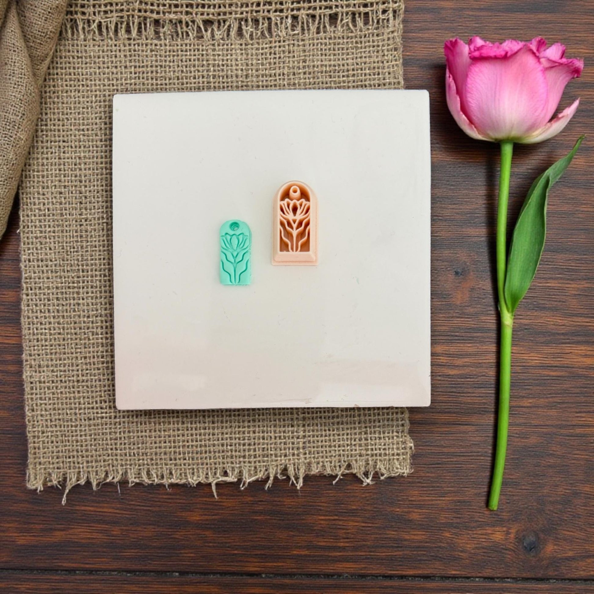 Small floral charm cutter on white tile
