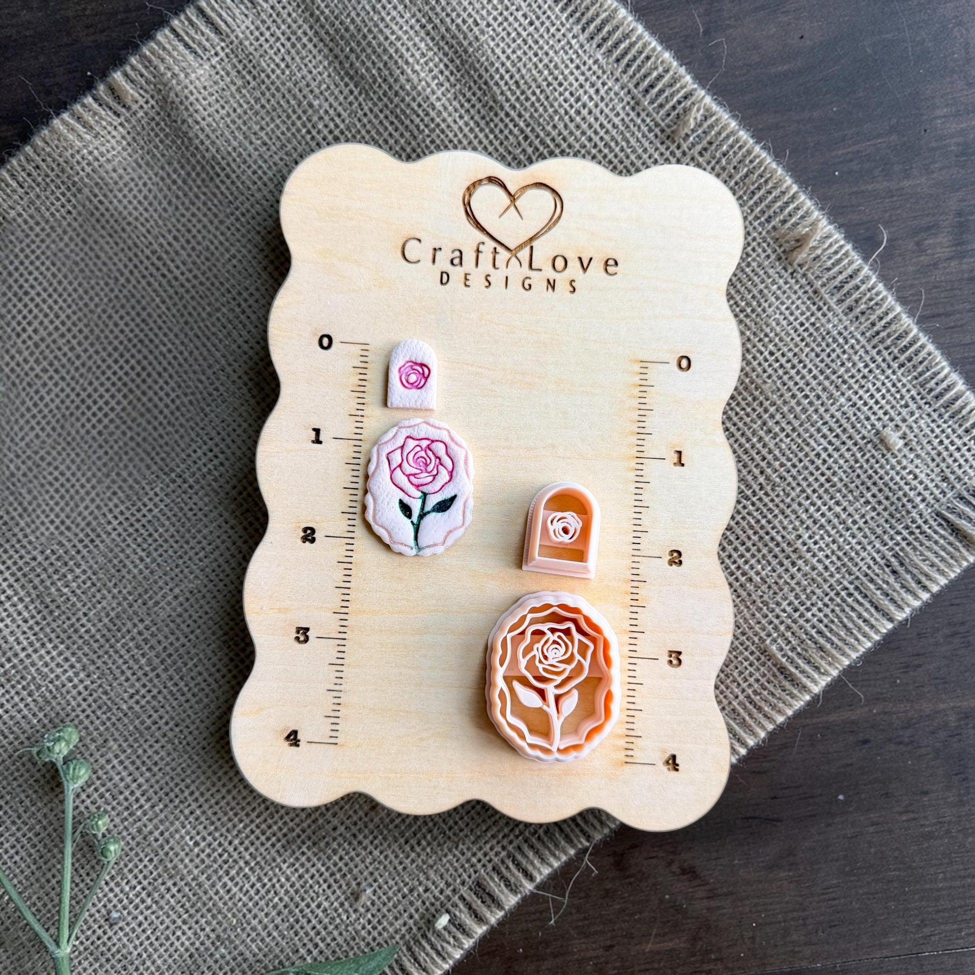 rose cameo cutter set and imprints arranged on wooden sizing board