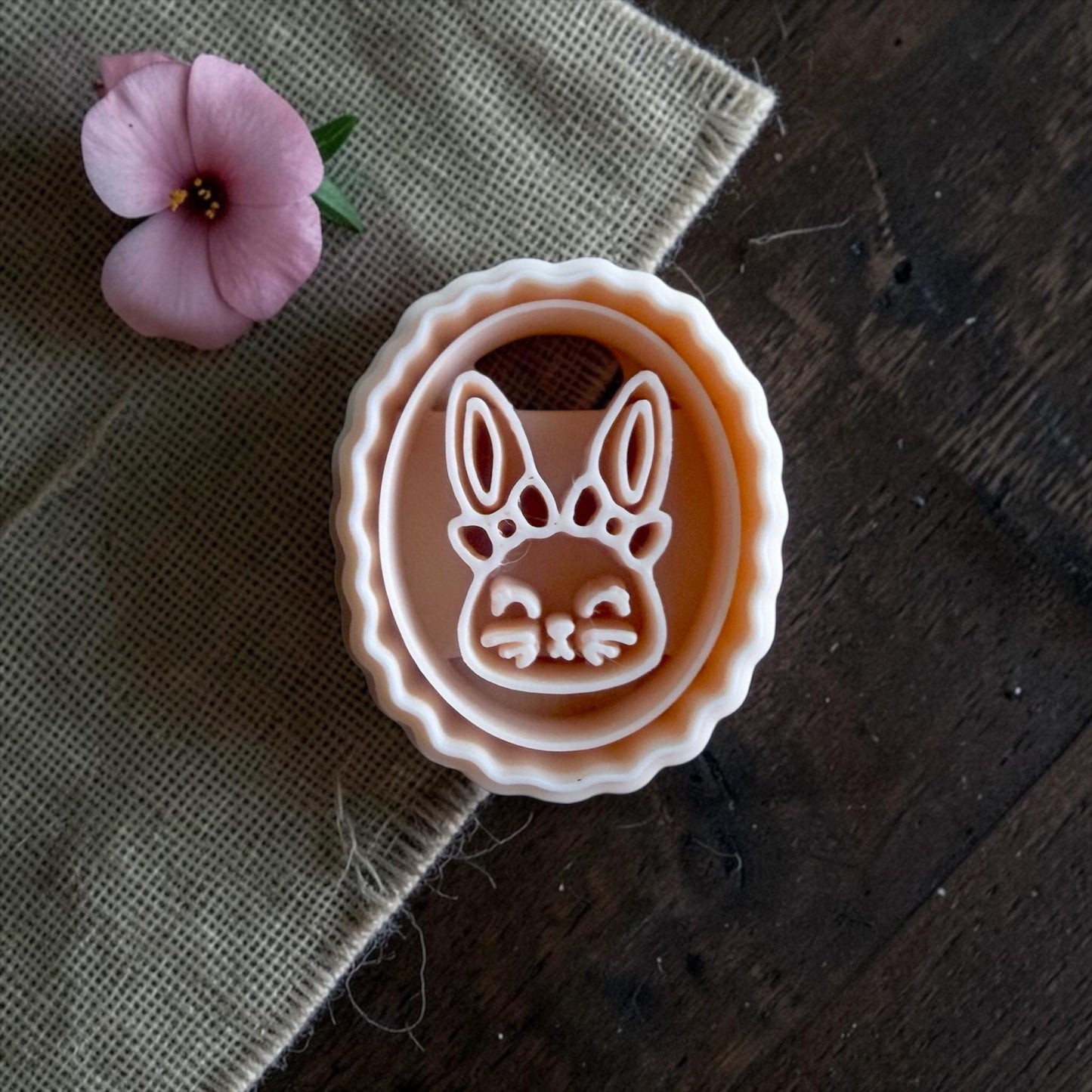 bunny clay imprint and cutter displayed side by side on sizing board