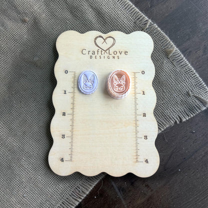 oval bunny cameo cutter resting on burlap with pink flower