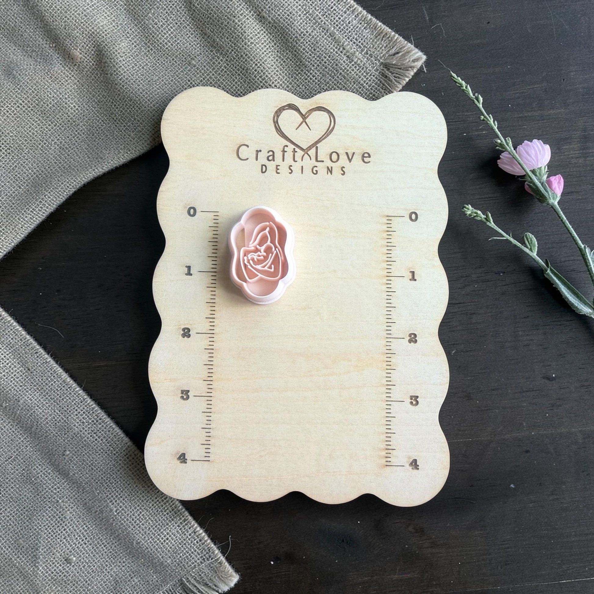 Mother and baby cutter on Craft Love Designs measuring board with greenery sprig