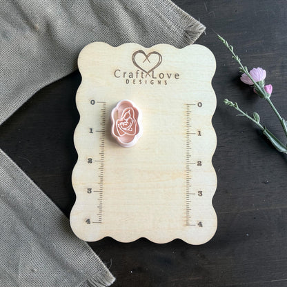 Mother and baby cutter on Craft Love Designs measuring board with greenery sprig