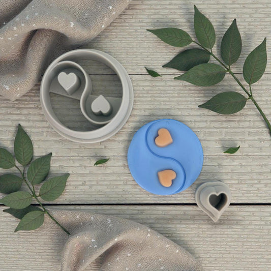 yin yang cutter with clay impressions and tiny hearts displayed