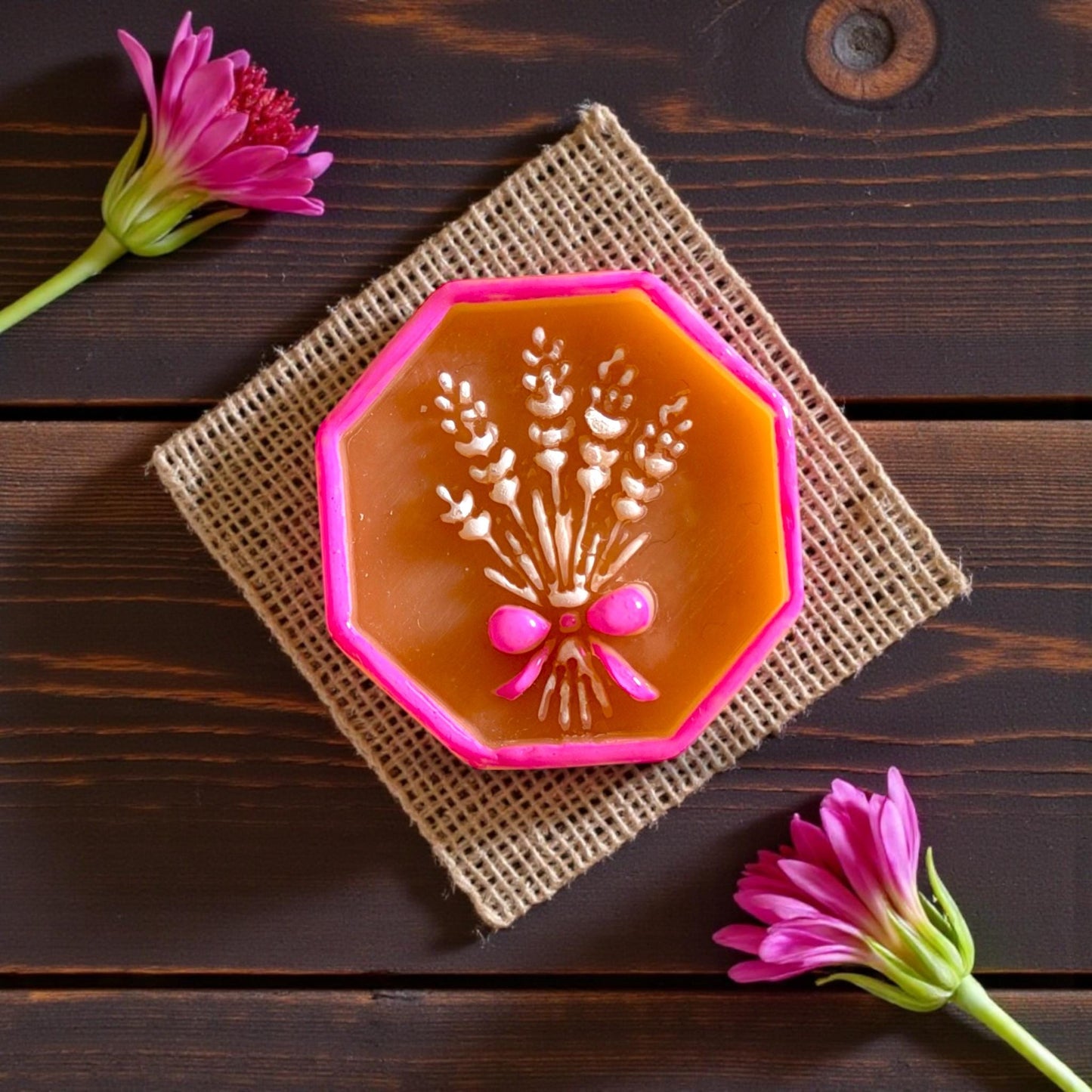 Closeup of wheat bouquet clay piece with pink frame