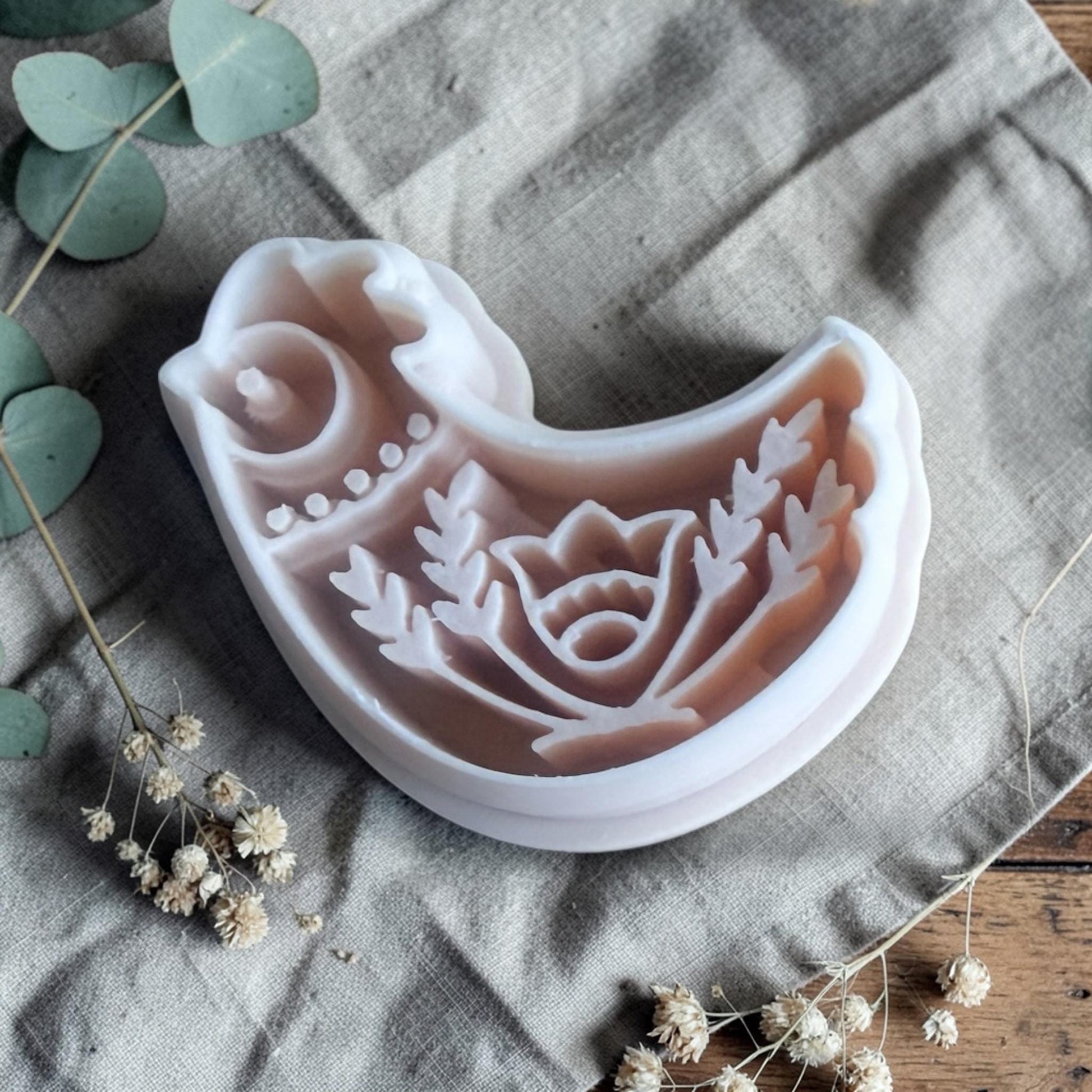 scandinavian bird clay cutter with floral details close view