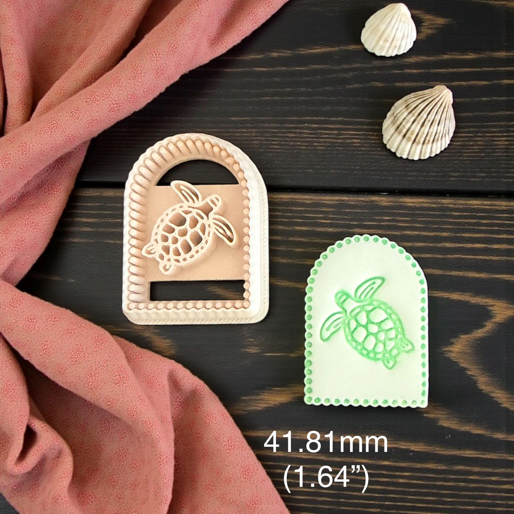 two arched turtle imprints on measuring board