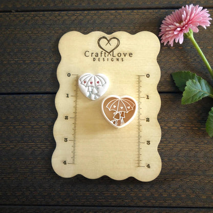 umbrella couple cutters on sizing board