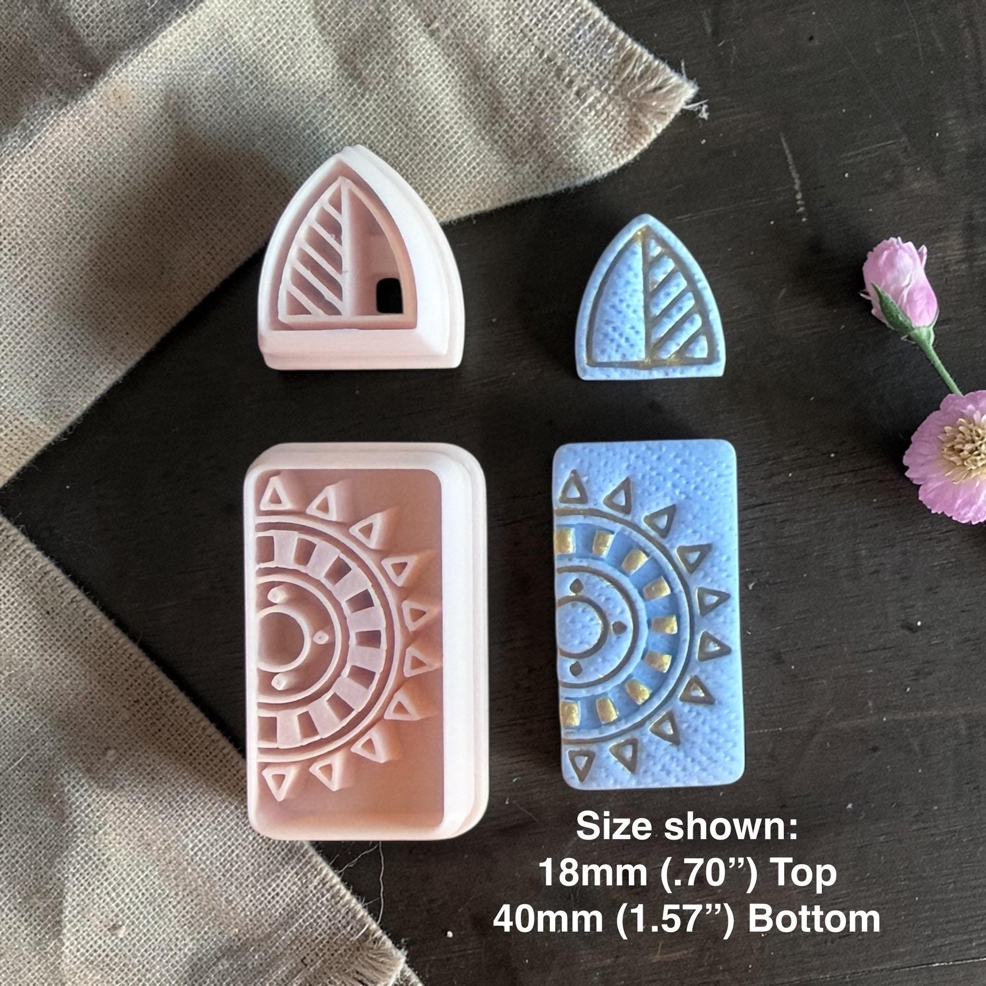 Polymer clay cutters and finished blue clay earrings with triangular stud and sunburst rectangle dangle