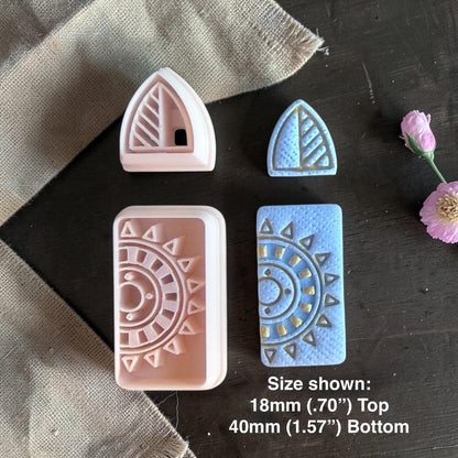Polymer clay cutters and finished blue clay earrings with triangular stud and sunburst rectangle dangle