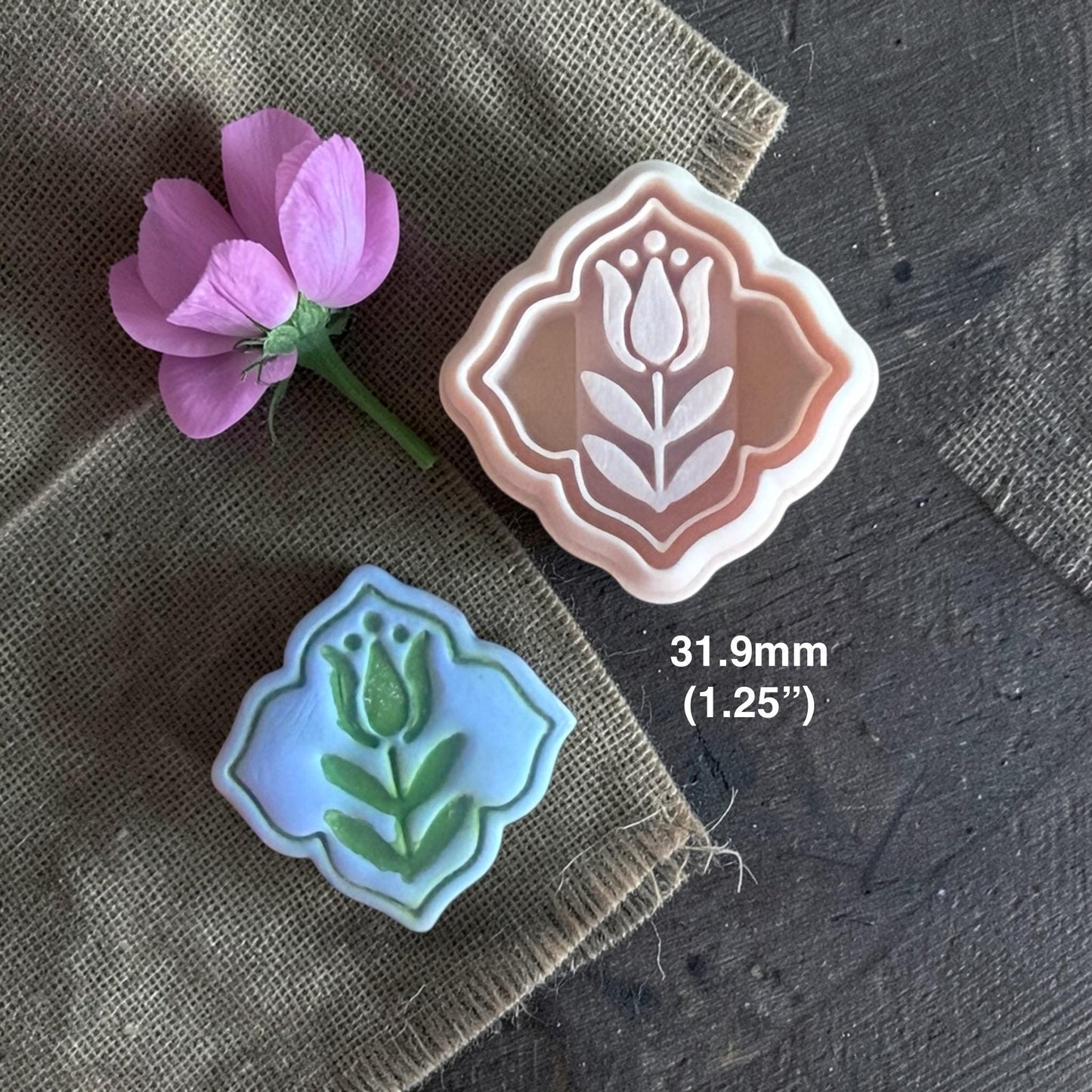Polymer clay cutter and finished blue clay tulip charm with text showing 31.9mm size