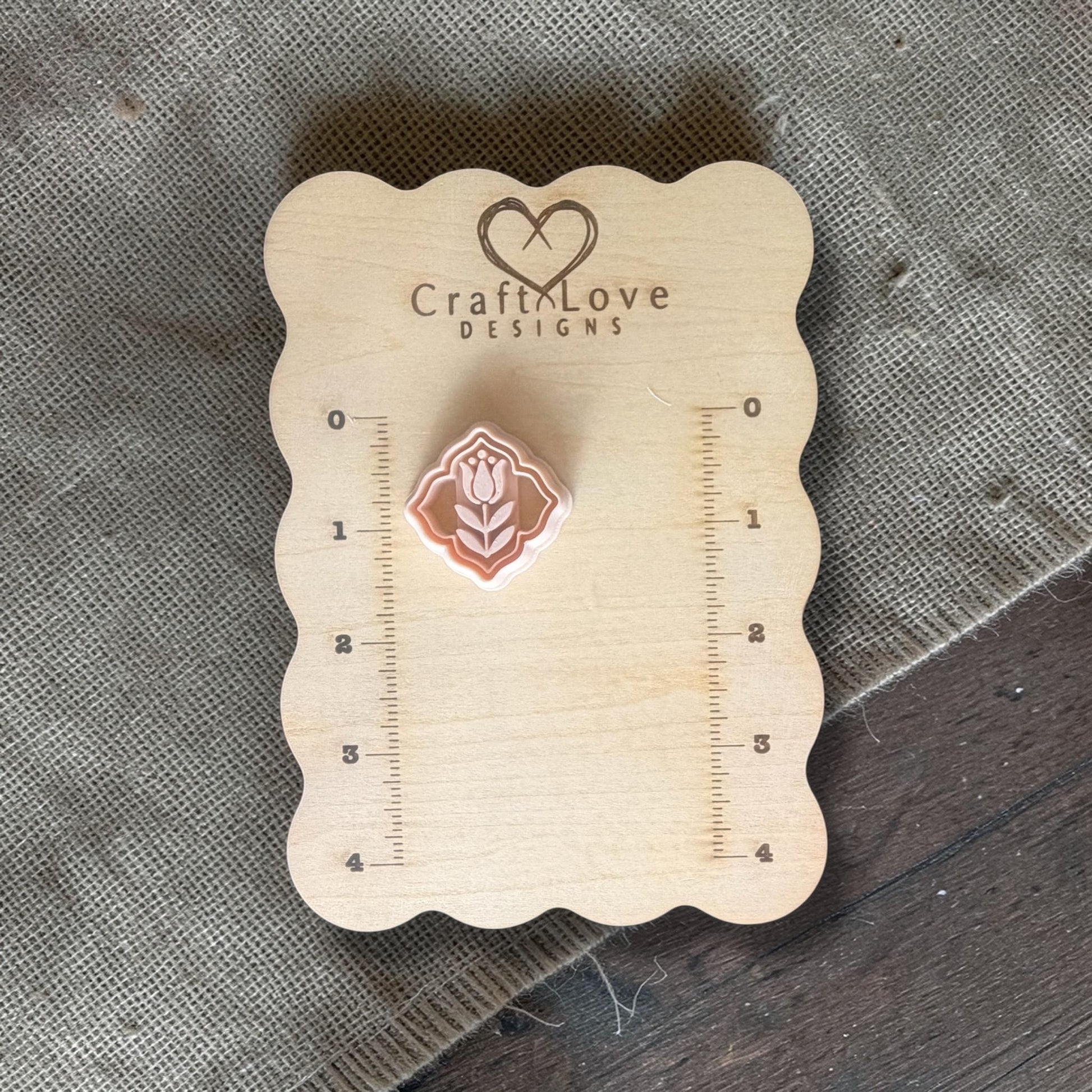 Polymer clay cutter displayed on Craft Love Designs wooden ruler board for size reference