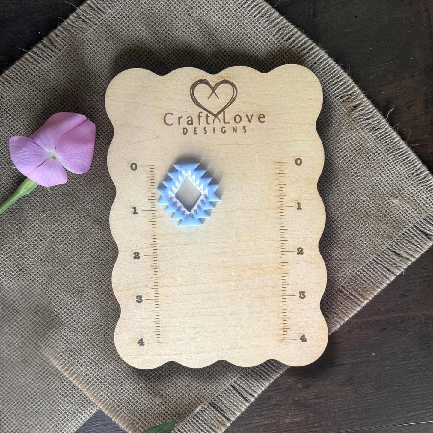 Finished blue aztec clay charm on Craft Love Designs ruler board