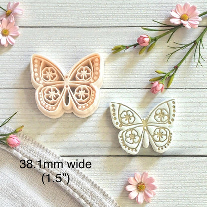 floral wings imprint next to cutter