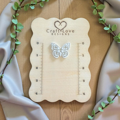 floral butterfly imprint on white wood