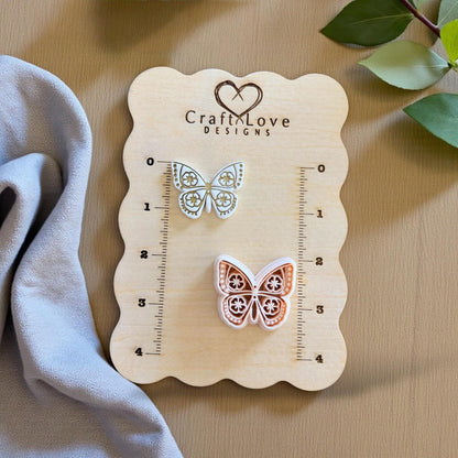 floral wings imprint next to cutter