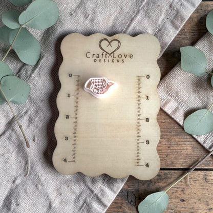 white polymer clay bird cutter displayed on Craft Love Designs ruler board