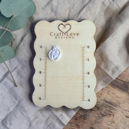 finished fox clay charm shown on Craft Love Designs ruler board