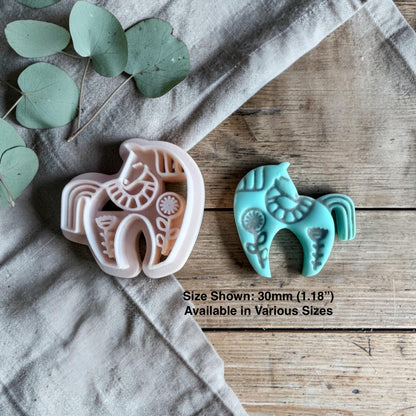 clay horse cutter beside finished turquoise horse charm showing size text