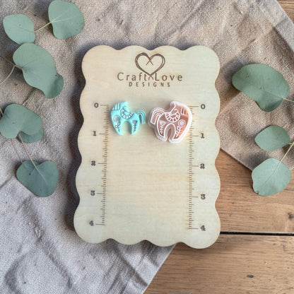 turquoise clay horse charm and white cutter on Craft Love Designs ruler board