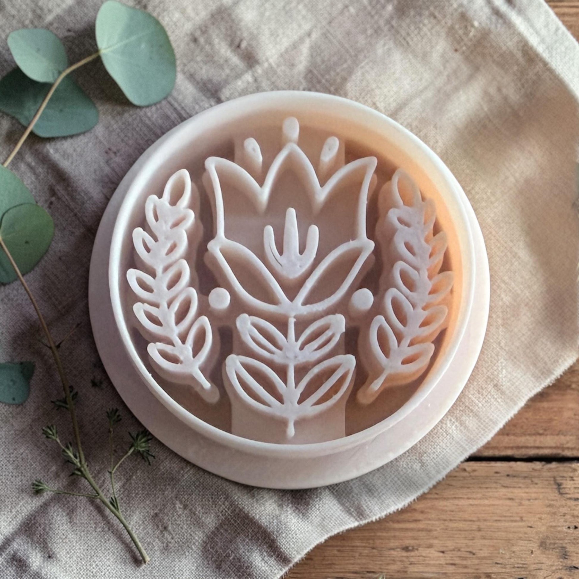 white Scandinavian tulip polymer clay cutter on linen background