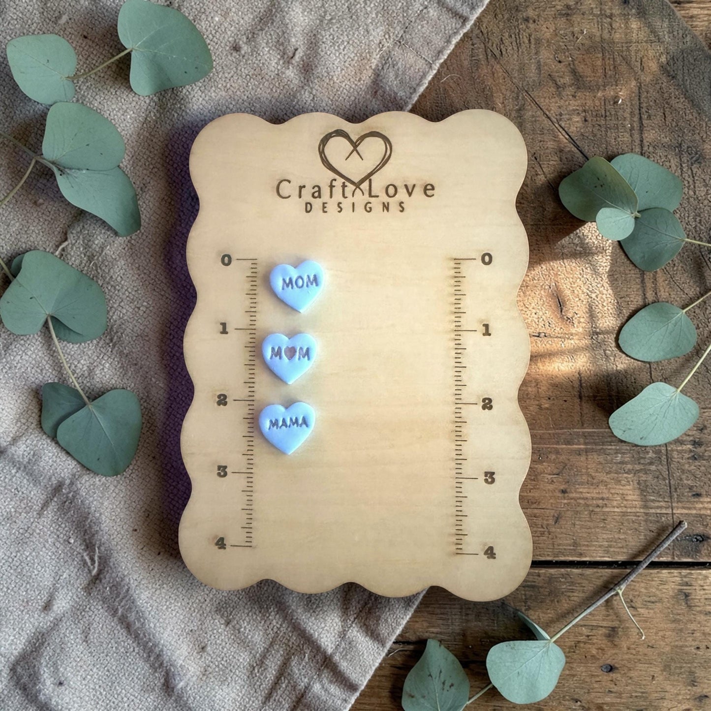 three finished heart clay charms with mom mama word emboss design