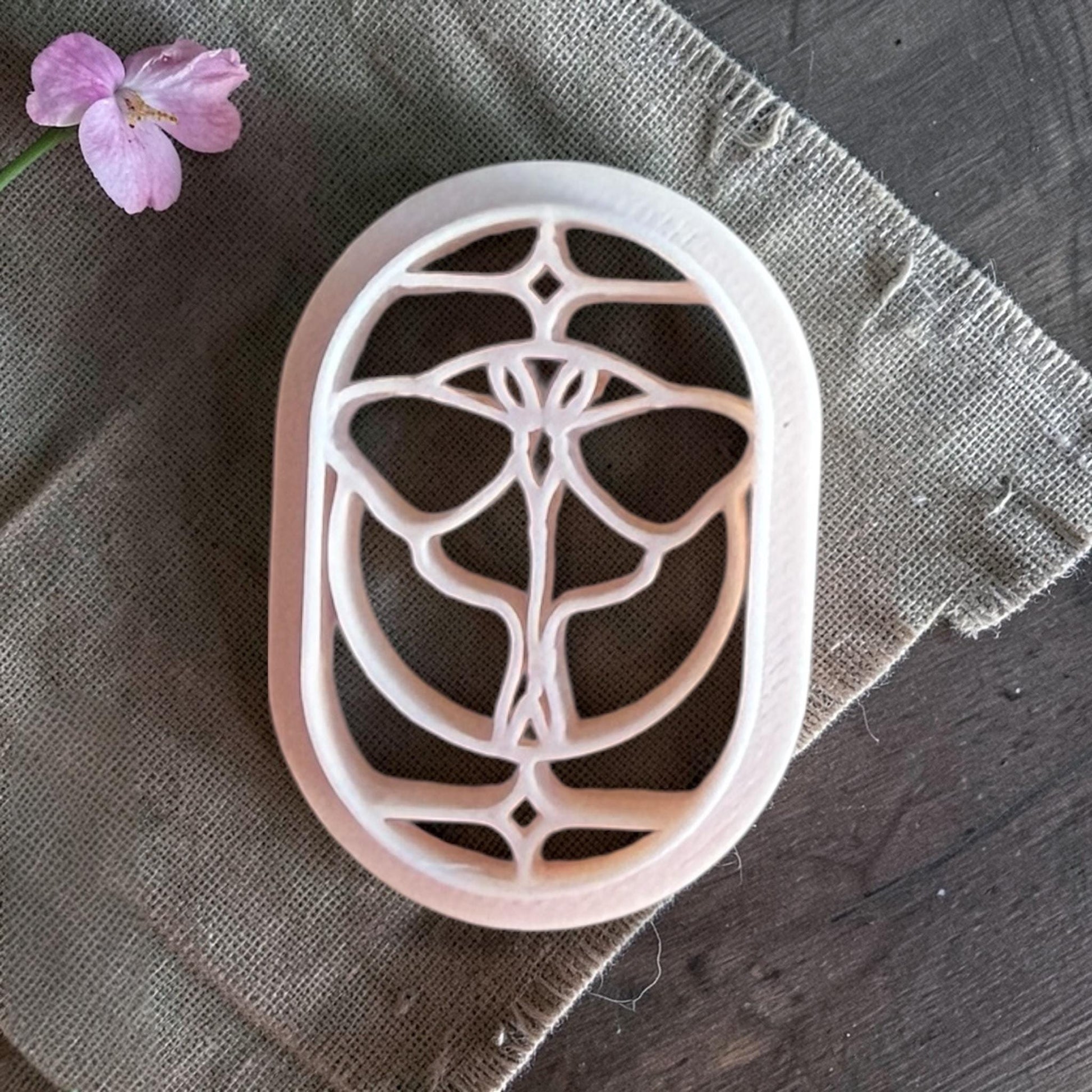 Beige butterfly cutter with a geometric wing pattern stained glass effect