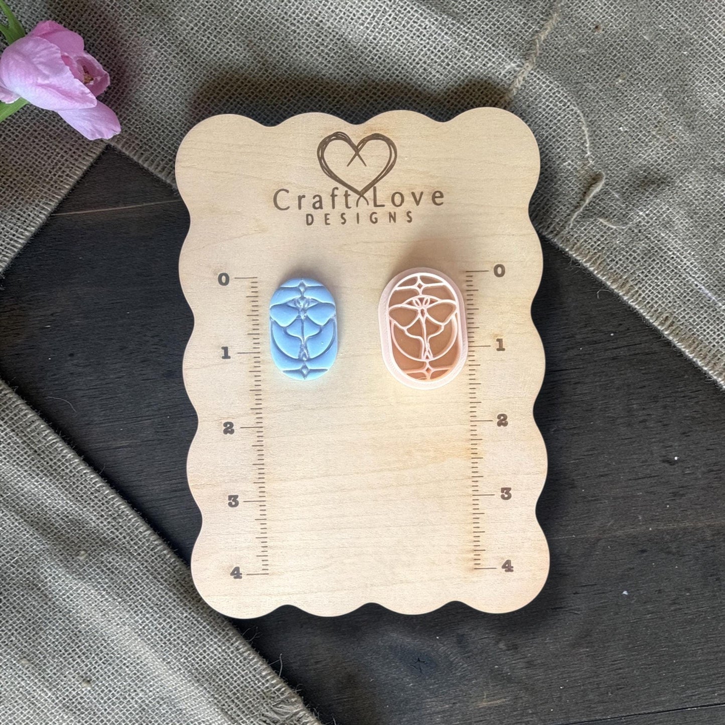 Polymer clay cutter next to sample clay piece.