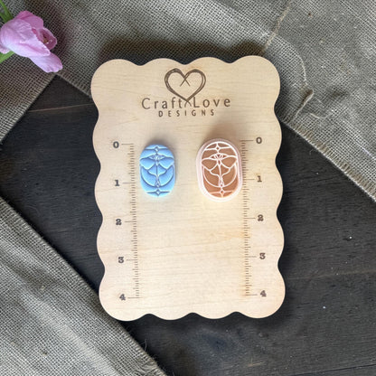 Polymer clay cutter next to sample clay piece.
