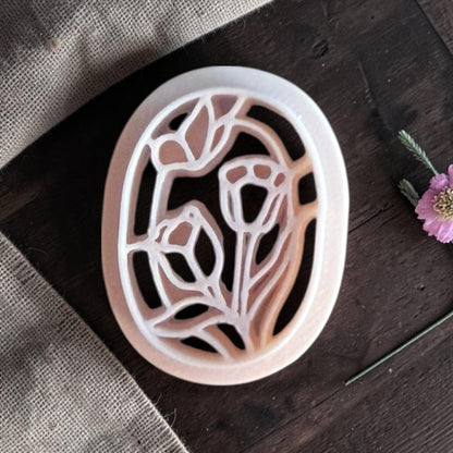 Beige tulips and butterfly cutter.