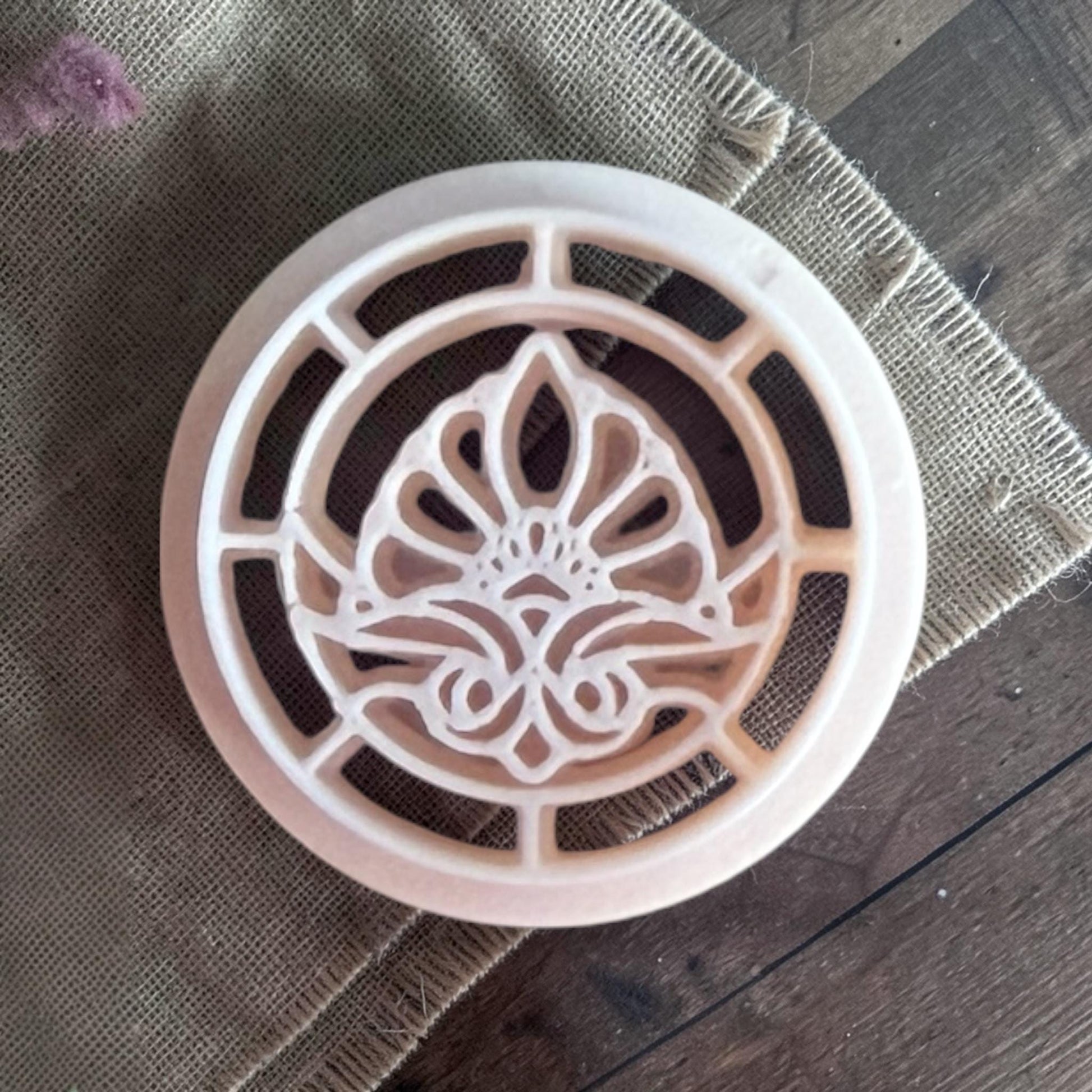 Beige stained glass floral cutter.