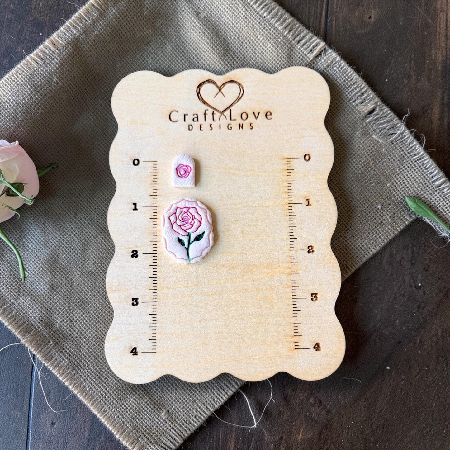 rose imprint pair on wooden sizing board with small rose topper