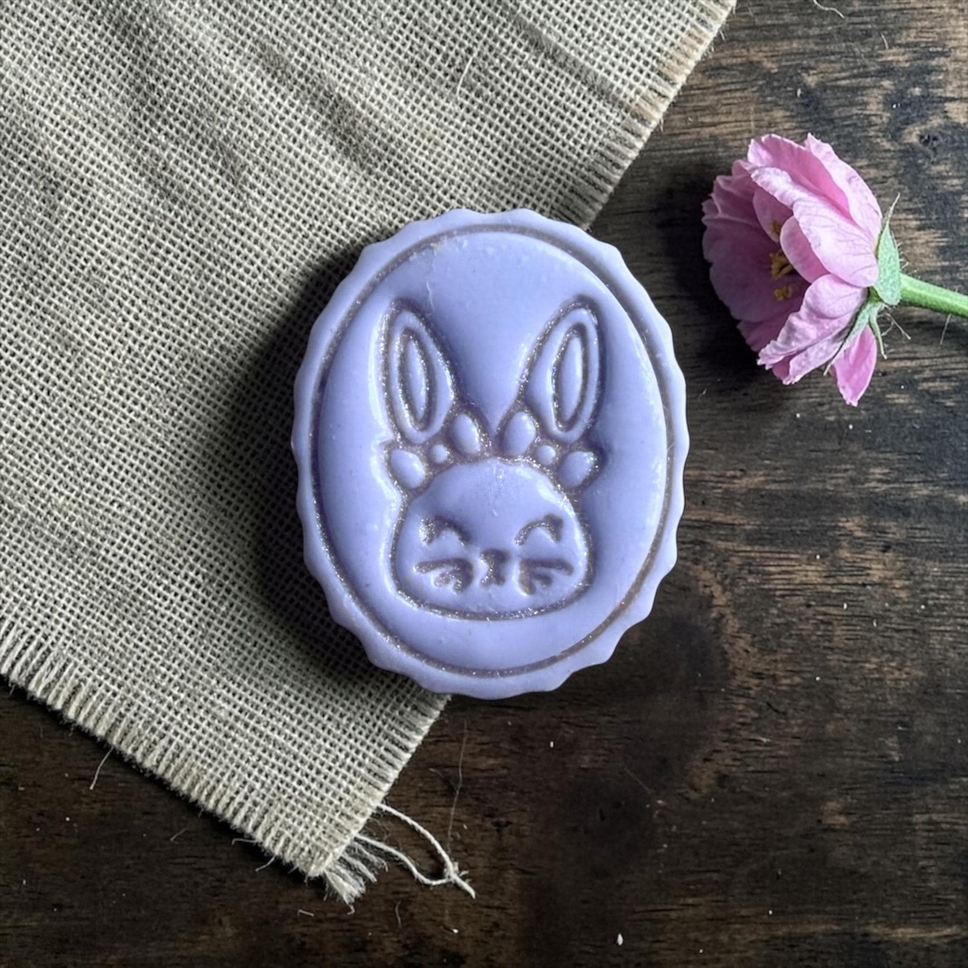 small bunny clay imprint on wooden sizing board