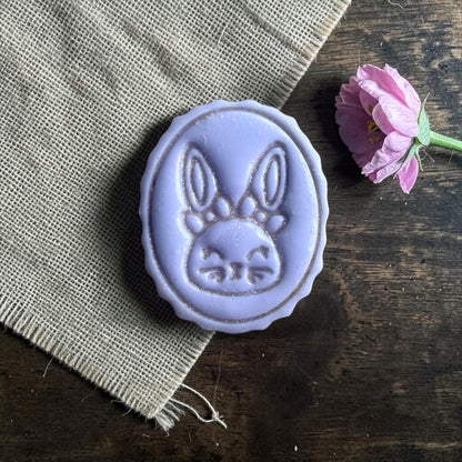 small bunny clay imprint on wooden sizing board