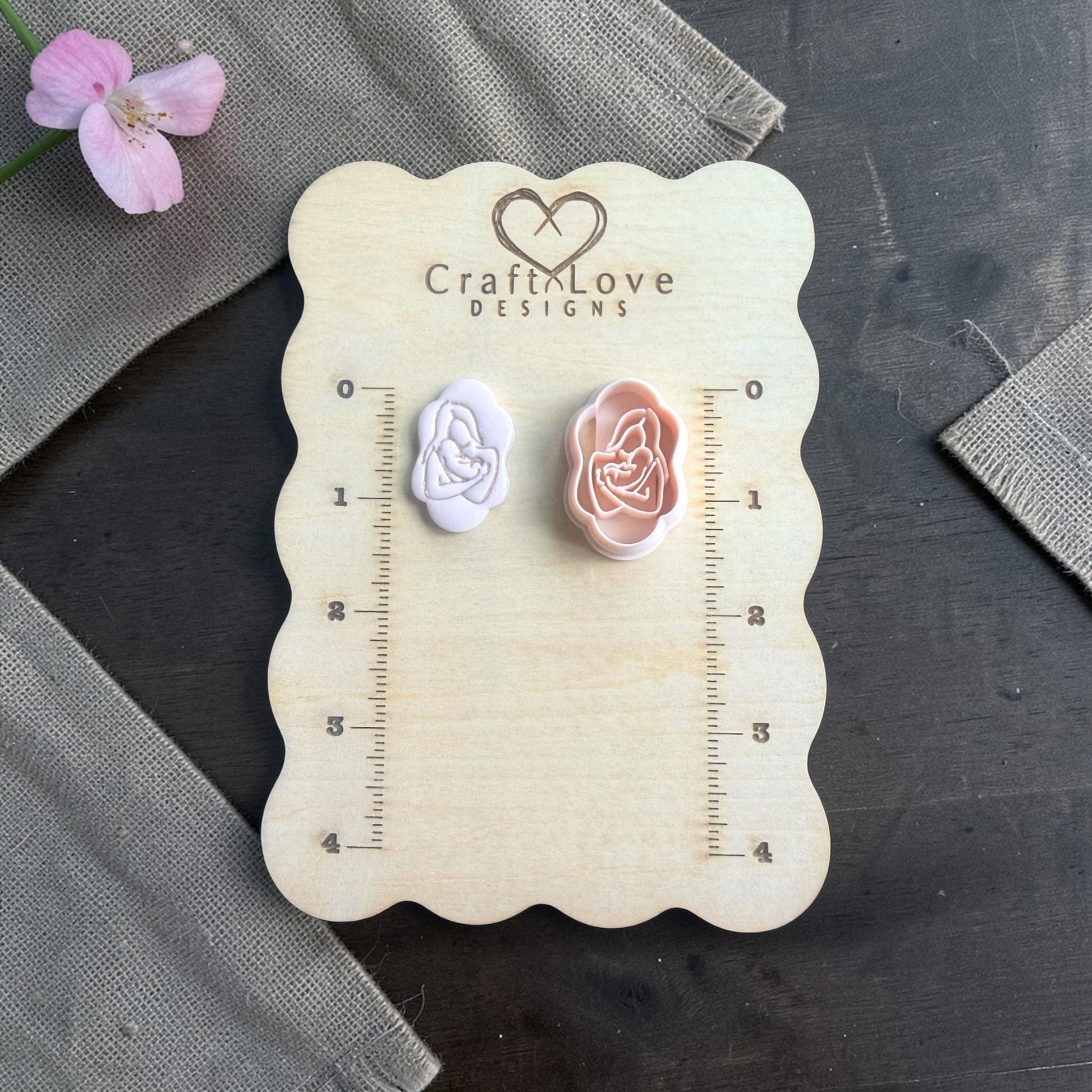 Mother and baby cutter and matching clay imprint side by side on Craft Love Designs board