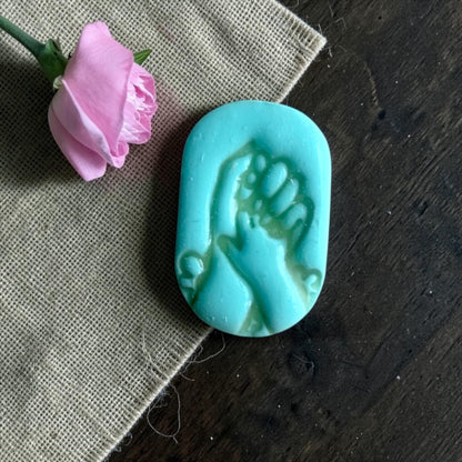 mom and baby hands clay cutter shown on measurement board
