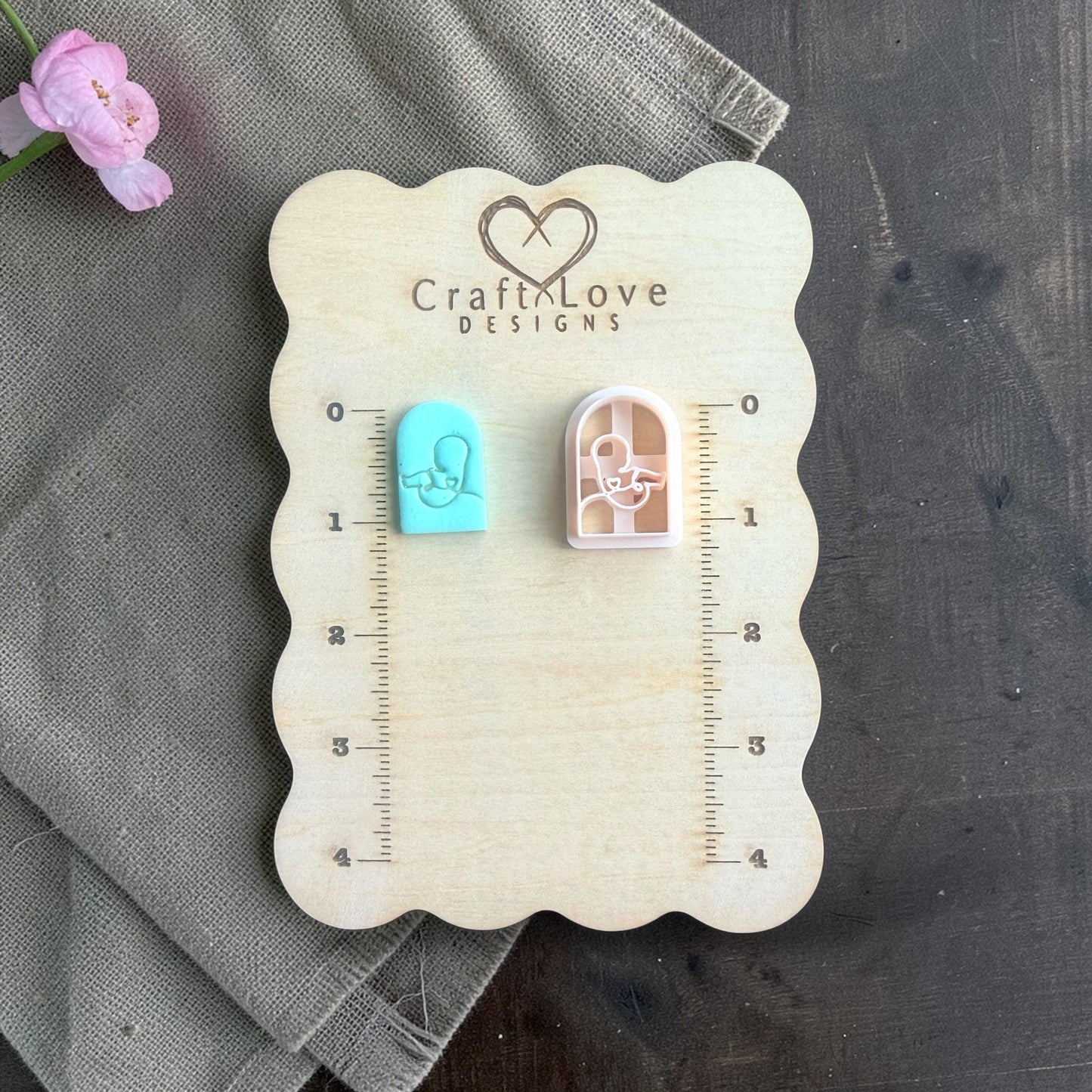 newborn silhouette clay cutter with finished teal clay piece