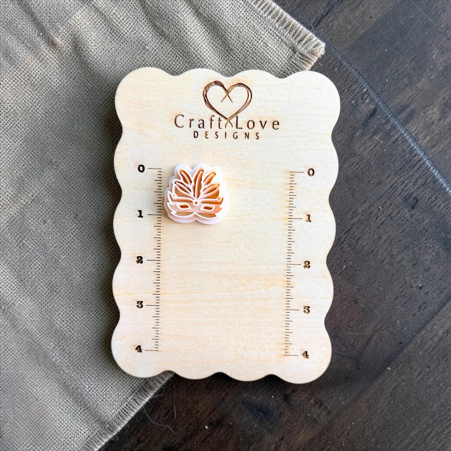 carnival mask clay cutter shown on measurement board