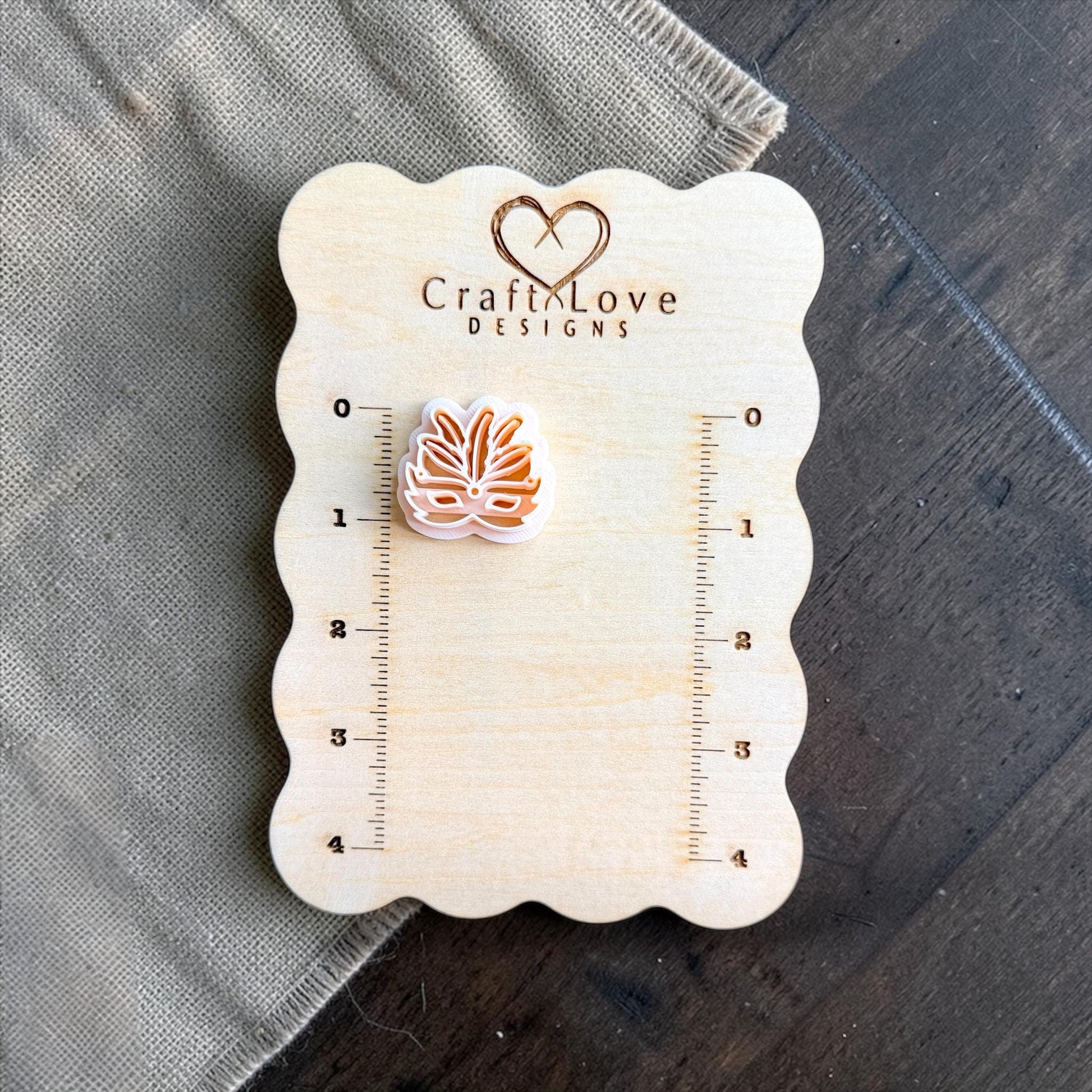 carnival mask clay cutter shown on measurement board