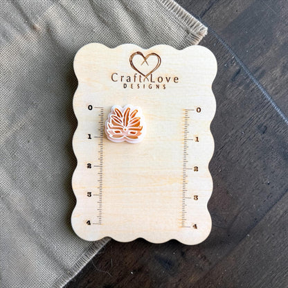 carnival mask clay cutter shown on measurement board