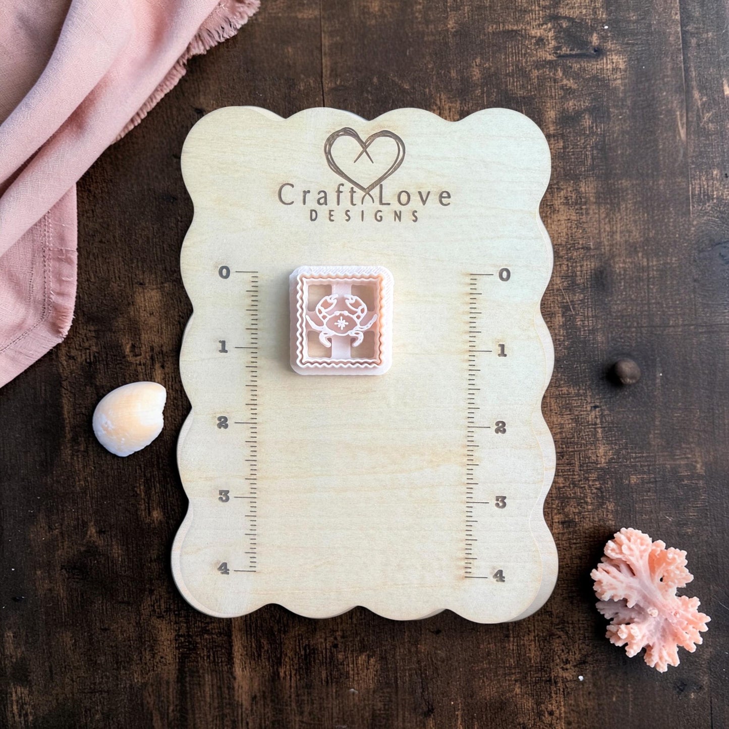 beige crab polymer clay cutter square scalloped frame on board