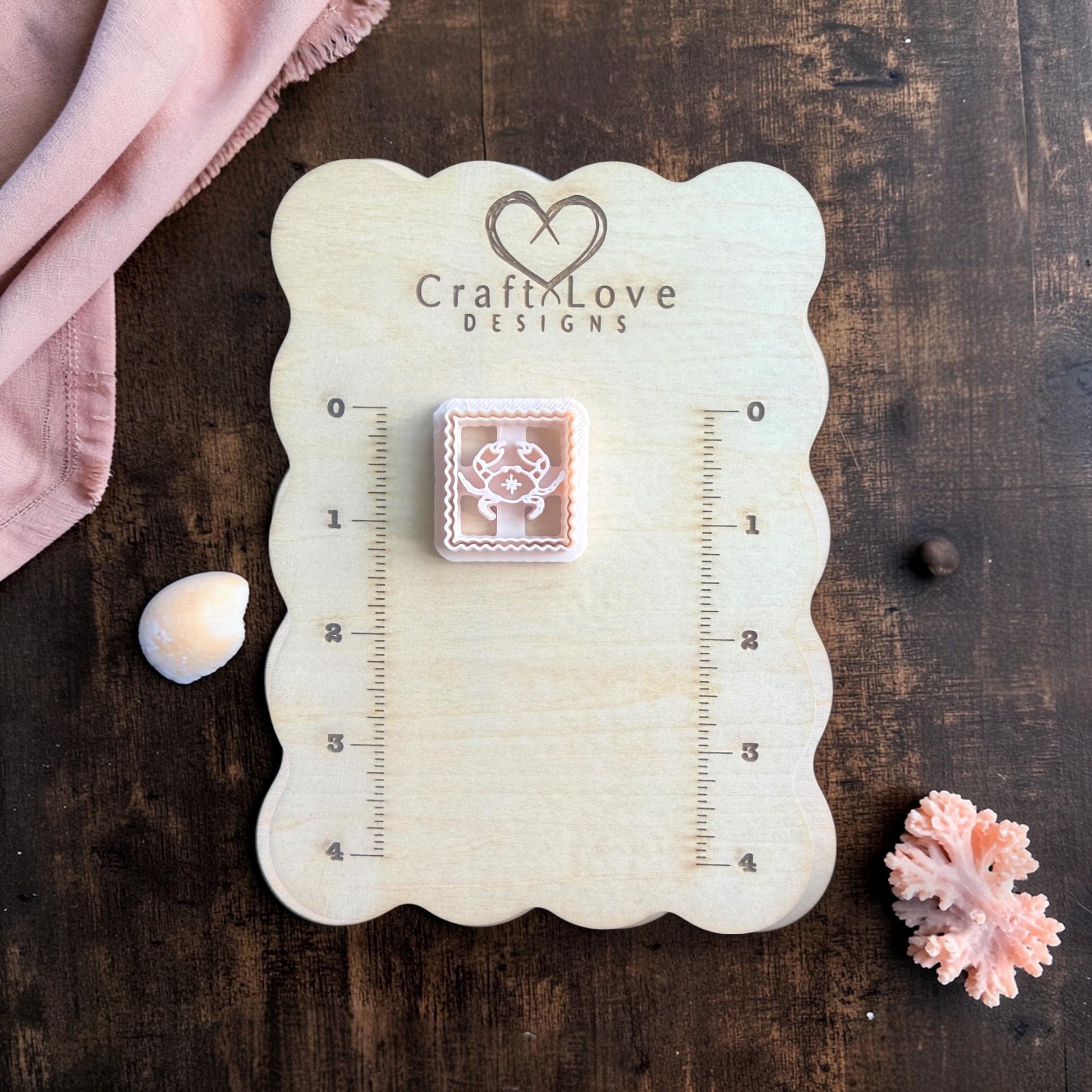 beige crab polymer clay cutter square scalloped frame on board
