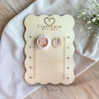 U cutout round cutter and clay piece shown on Craft Love Designs board