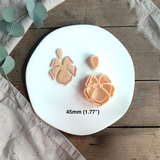 Cutter and finished clay pieces shown together with size text 45mm on a white plate with soft neutral styling.